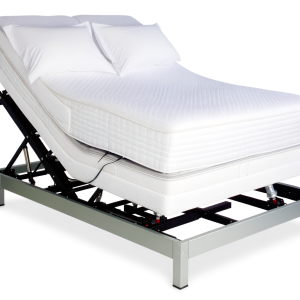 adjustable electric kingsized bed on a white background - the bed is raised partially. Make the bed look comfortable, show a contented sleeping person laying on it